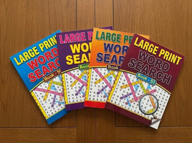 Large-print puzzle books ready for a session